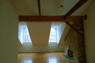The top floor before the renovation felt cramped, and held another defunct fireplace in need of restoration. 