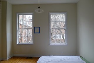 A second upstairs bedroom with a defunct brick fireplace would become an office. 