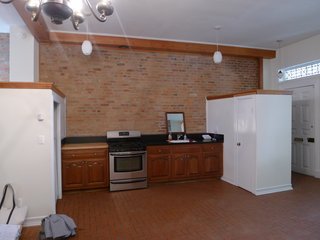 The floors were covered in red tile, all of which was removed. 