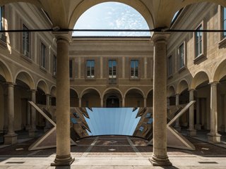 "The idea was to actively and seamlessly merge the beauty of the surrounding architecture and the sky over Milan, creating an ever-changing experience," explains Phillip K. Smith.