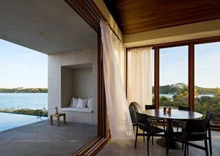 A dining area opens to the poolside terrace, providing both sea breezes and beautiful views. 