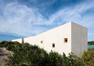 This first volume sits like a long, slender bar providing privacy from the adjacent street. 