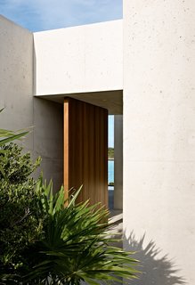  An oversized mahogany door provides a grand entrance to the complex.