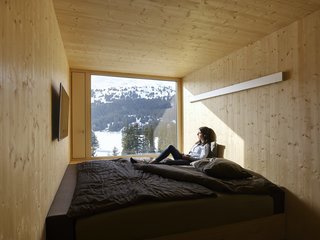 The minimalist interiors feature a wall-to-wall bed to maximize the small space. The standard rooms are the width of each bed. There are also four barrier-free rooms, along with 28 triple-bed rooms. 