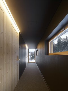 A long corridor provides access to the individual rooms. 