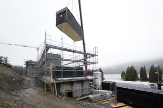  A room module being lowered into place. 