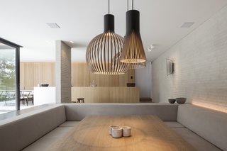 The dining room nook has the feeling of a conversation pit. 