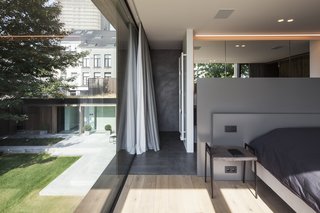 The second-floor bedrooms and bathrooms are connected via a central closet. 