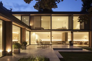 At night, the building becomes a light box glowing from within. 