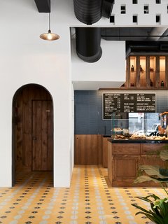 Vibrant handmade cement tiles line the floor. 