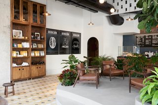 Wood and leather loungers add an element of warmth to the interior. 