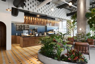 The diverse material palette includes Colombian wood, concrete blocks, tiles, and stone. 