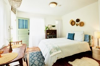 The detached guest house is a spacious one-bedroom retreat, complete with a fully equipped kitchen and bathroom. 