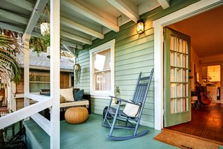 The bungalow features a traditional porch entry. 
