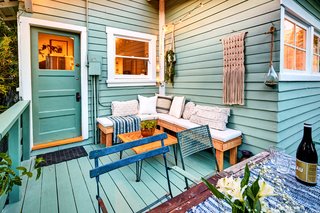 The landscaped lot offers an outdoor lounge, herb garden, lemon tree and passionfruit vines.