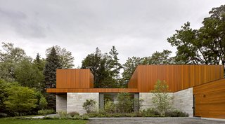 The exterior is a mix of wood and stone, and the ground floor is clad in locally-quarried Algonquin limestone around the perimeter. 