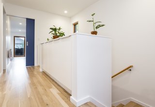 The master bedroom, the child's room, two bathrooms, and an office space are located on the second level. The white cabinets allow for additional storage space. 