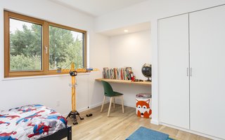 A built-in desk in the kid's room is simple, yet fully functional. 