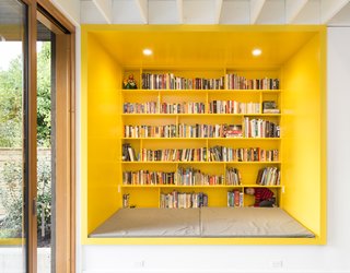 Thanks to a spacious bookshelf and plenty of seating, this vibrant area is an inviting spot to read and relax.