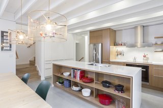  Custom white oak faces for the IKEA cabinets were made locally by Kokeena. 