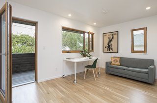 A home office is located on the upper floor at the front of the house with a private balcony that also serves as the covering of the front porch. 