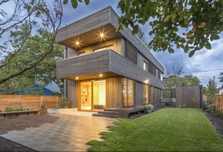 The home is a unique response to a standard 50’ x 100’ infill lot. Rather than a typical full-width house with a front and backyard, the architects have designed a long and narrow floor plan to create a sunny south façade. The house presents its very narrow end with a cantilevered balcony and front porch to the street, allowing it to visually recede. The long, built-in planter separates the porch from the street and creates an additional layer of privacy. <span style="color: rgb(204, 204, 204); font-size: 13px;">Built Photo</span>