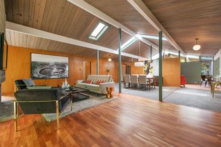 Many appealing original features are still in place, including Philippine mahogany walls, original globe lights, Japanese closet doors, floor-to-ceiling windows, and aggregate concrete flooring in the entrance and dining area. The radiant flooring is also in good working condition.
