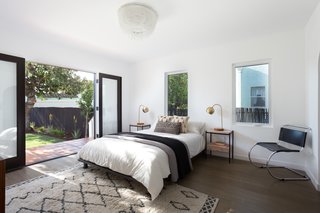 The real gem is the master bedroom which features sliding doors that open to the expansive backyard—perfect for embracing indoor/outdoor living. 