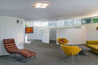 A look at the sitting room on the second level with a separate niche for an office. 