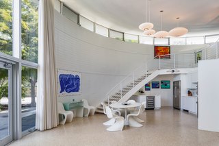 Clerestory windows line the perimeter of the soaring light-filled home. 