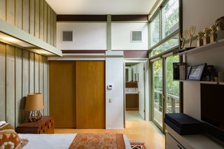 The master bedroom has an ensuite bathroom, along with doors that open to the deck.
