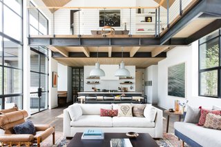 Upon entering the home, guests come into a bright and airy, double-height great room. Part of the challenge for the design was to figure out how to make each space feel separate while making the entire home feel cohesive. 