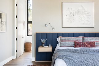 The custom built-in bed and bedside tables are from ABD Studio. The art above the bed was commissioned from James Surls. 