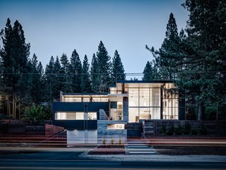 Burnt Cedar is anchored to its sloping site through a series of steps that lead from the street level to the front entrance.