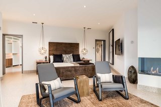 The master bedroom boasts a switch-operated DaVinci gas fireplace. 
