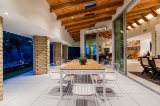 The dining room area opens to a terrace which evokes the "chic earthiness" of the era while incorporating an effortless indoor/outdoor lifestyle.