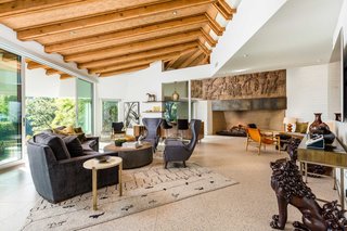 The landing above the earthenware fireplace features an original frieze depicting an interpretation of The Doors band members.