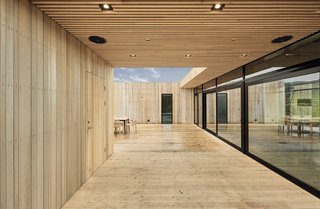 The deck is covered with an extended cedar canopy. 