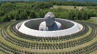 Visitors now approach the Buddha through a 130-foot-long passageway into the circular space surrounding the statue.