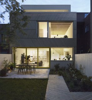 The backyard exterior view at night. 