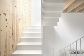Thanks to the crisp neutral shade, the staircase carries light from floor to floor. 