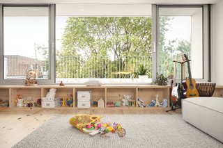 The large windows open to the deck, giving the room a strong connection to the outdoors. 