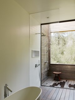 The master suite bathroom features an outdoor shower. 