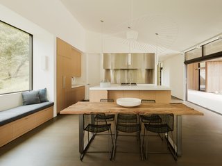 A restrained material palette creates a tranquil atmosphere in the elegantly appointed open kitchen. 