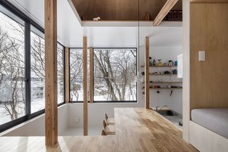 A view of the kitchen from the living room. The reading nook/bench is another layer of space. 