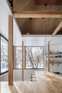 Full-height windows wrap around the home, giving jaw-dropping panoramic views of the lake. 