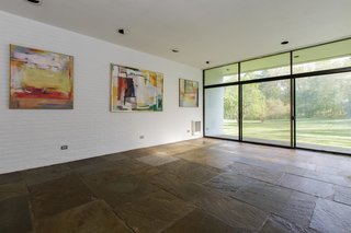 White walls and ample natural light create a vast sense of space. 