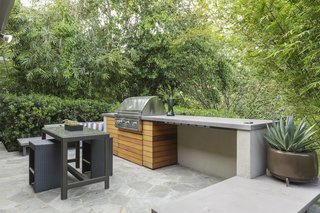 The barbecue area has easy kitchen access and features built-in seating for entertaining. 