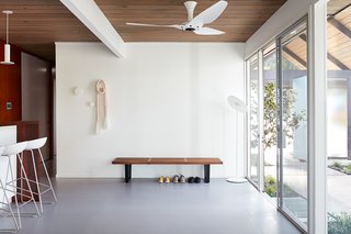 The space between the kitchen and atrium is also flooded with natural light.