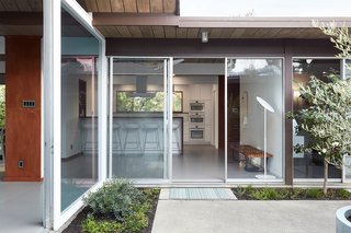 The atrium-style design perfectly integrates a sense of the outdoors throughout the home. 